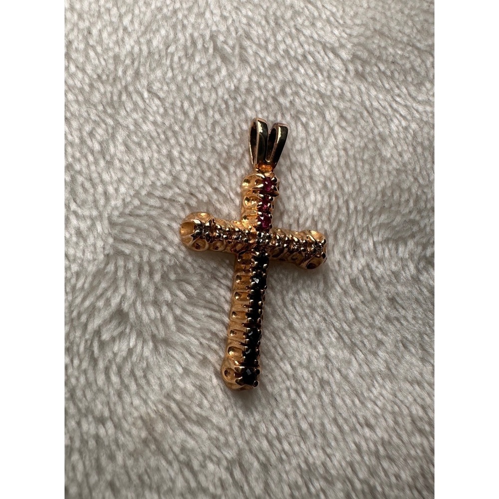Vintage HONY 14K gold cross pendant with diamonds, sapphires, and rubies.